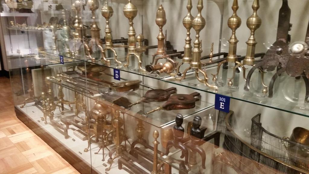 photo of a virine full of brass andirons at the met museum, by mriver