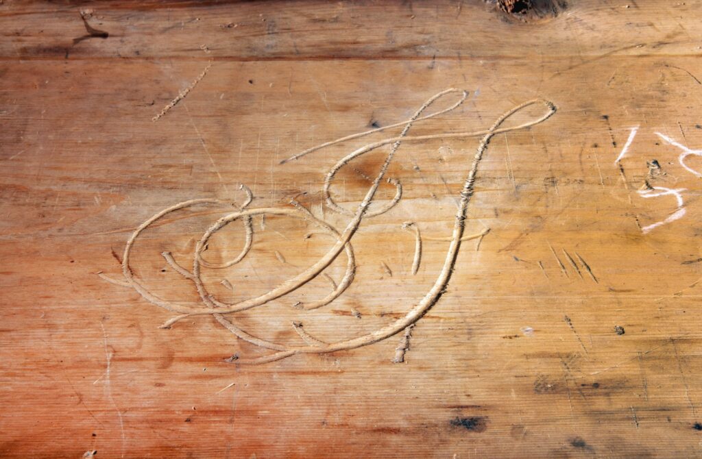 gorgeously carved initials JF, hidden inside a circa 1770 chest-on-chest from Philadelphia being sold at Sotheby's