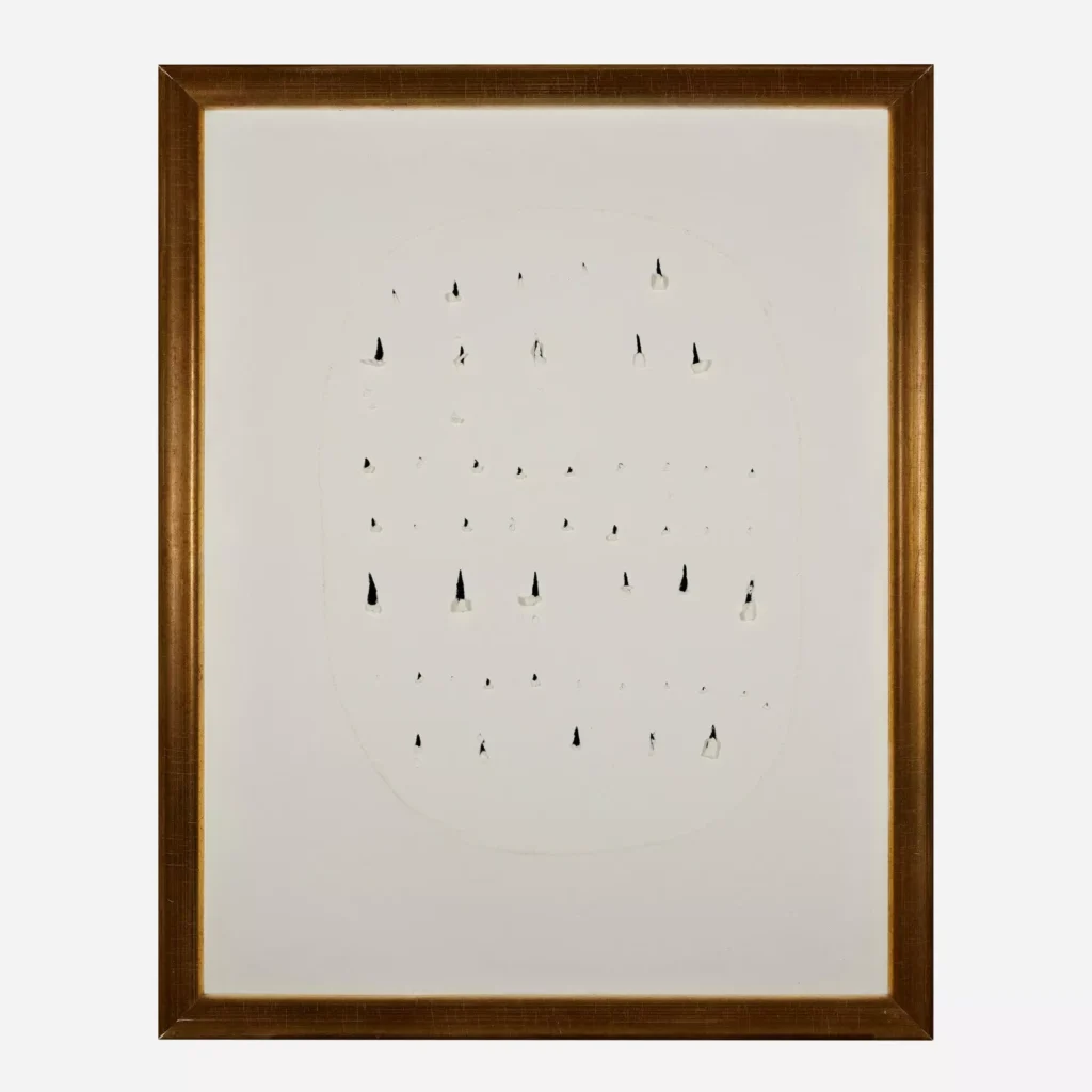 a fontana concetto spaziale in paper is framed in a bland dark gold. it is a series of uneven rows of stab marks, like with scissors, roughly outlined with an egg like oval. sold at rago in 2024