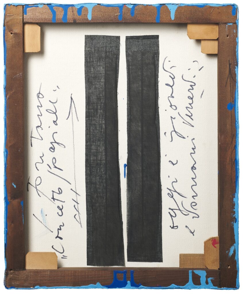 the back of a lucio fontana painting at il ponte auction house in milan with drips of dark blue underpainting and the lighter blue top coat on the brown wood stretcher bars, held in place with wood shims. two vertical strips of black fabric tape in the center of the canvas hold the slashes in the loose stasis we expect from fontana. the title and signature are written in quick fast italian cursive with an arrow indicating the orientation