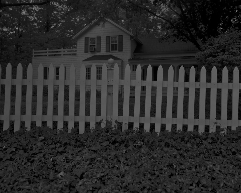 dawoud bey's nighttime photo of a 19th century white painted farmhouse near cleveland with a white picket fence in front of it, this image has been lightened to be more legible in reproduction. via the art institute of chicago