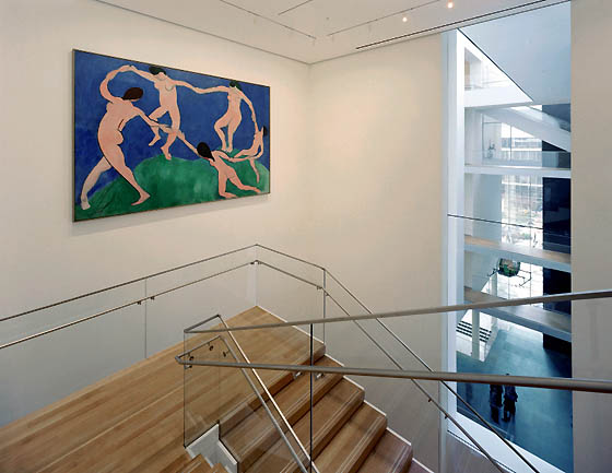 matisse's dance hung above a floating staircase with glass safety rail, and long window beyond facing onto moma's atrium, with multiple catwalks and the sculpture garden beyond, one of the dramatic details of yoshio taniguchi's moma redesign, image: tim hursley, 2004