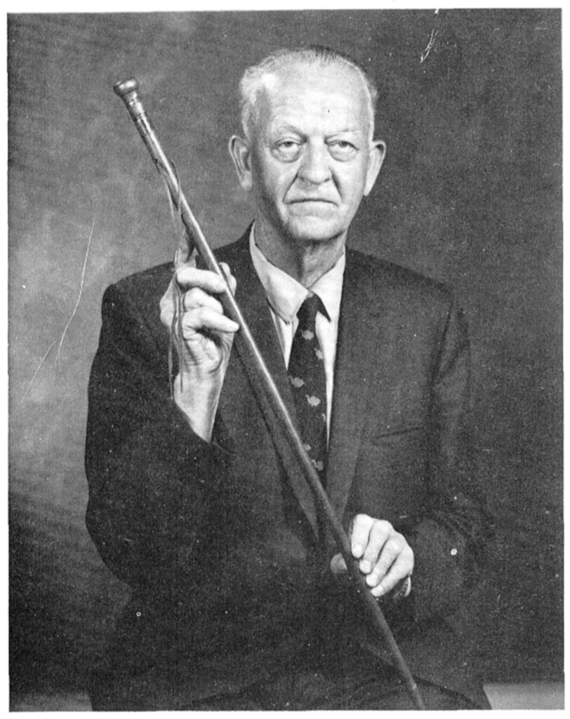 an unsmiling, thin, old white guy in a dark suit and tie sits holding a walking stick carved, we're told, from the blood-soaked oak boards of the temporary coffins that carried the murdered Mormon prophet Joseph Smith and his brother Hyrum back to Nauvoo, Illinois in 1844. the man is richard taylor, whose father john taylor was with the Smiths when they were killed. this photo was republished in 1981 in byu studies journal