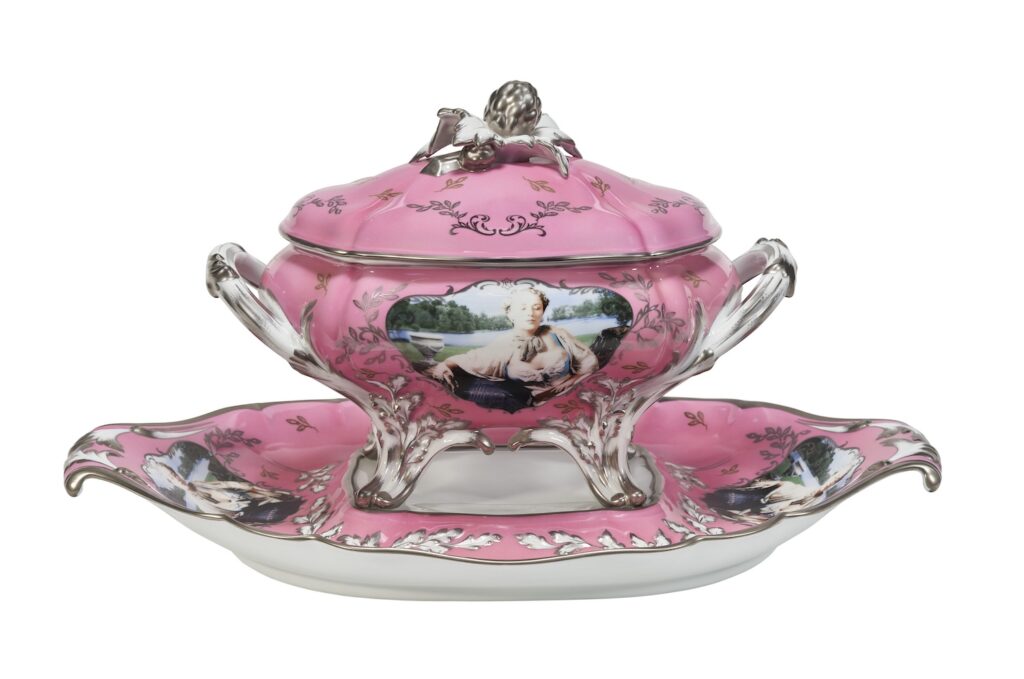 a pink soup tureen on a pink platter with elaborately screenprinted portraits of cindy sherman as madame pompadour, created in 1990 in an edition of at least 100, 25 in each of four colors, this one being sold at christies in feb 2025