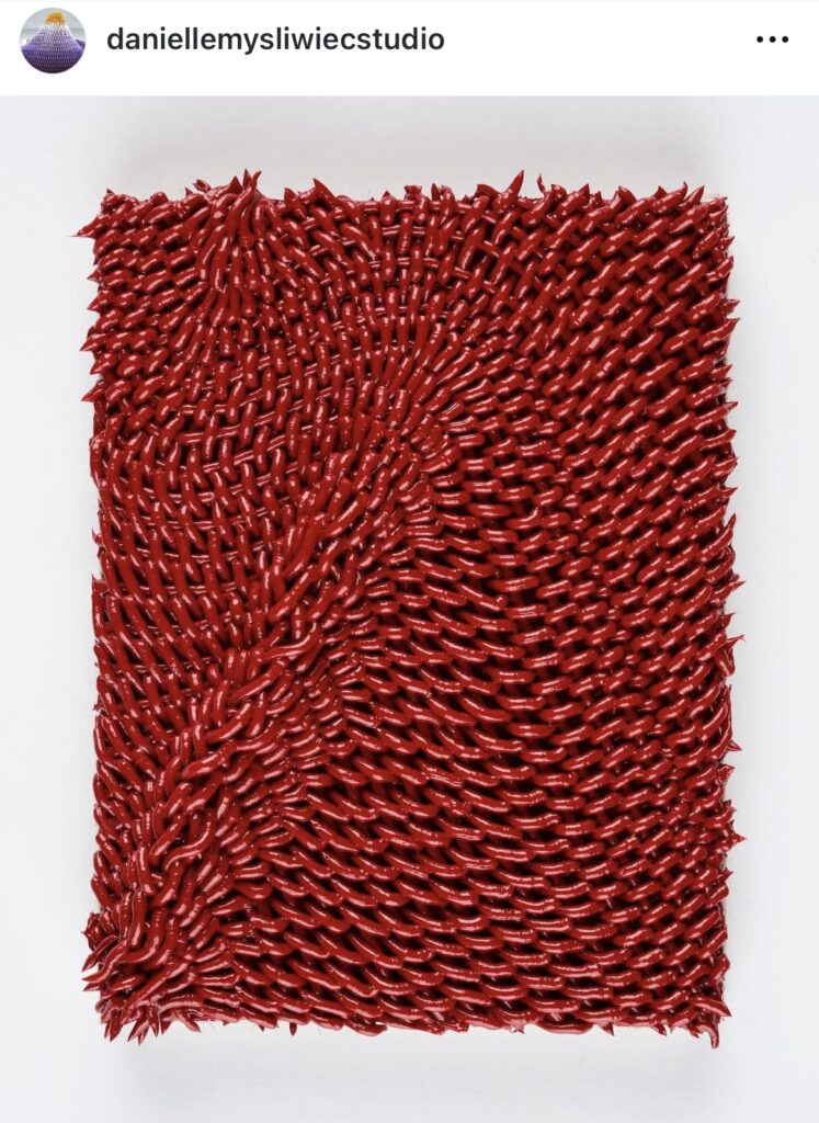 gather, miniature (red) is a 4 by 3 inch oil painting in which the red paint is extruded in such a way that it appears to be a loosely woven textile or basket, an effect enhanced by a diagonal ripple or ridge in the surface connecting to the lower left corner of the canvas-wrapped panel. the links of paint along the ridge are looser, less systematic, like a braid in some places, and around the edge of the painting, loose points of paint protrude like little anemones or spikes. by danielle mysliwiec from her insta