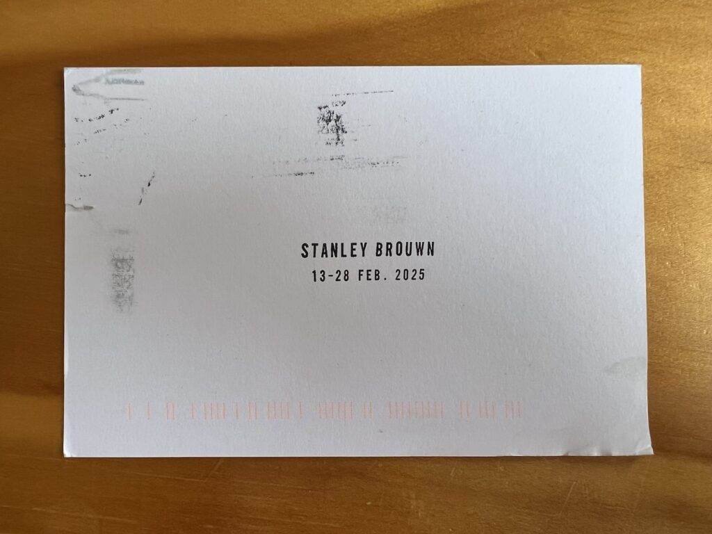 an invitation card stamped with stanley brouwn/ 13-28 feb. 2025 on it, and some postal service scuff marks, for a show opening at portal 5 in tribeca