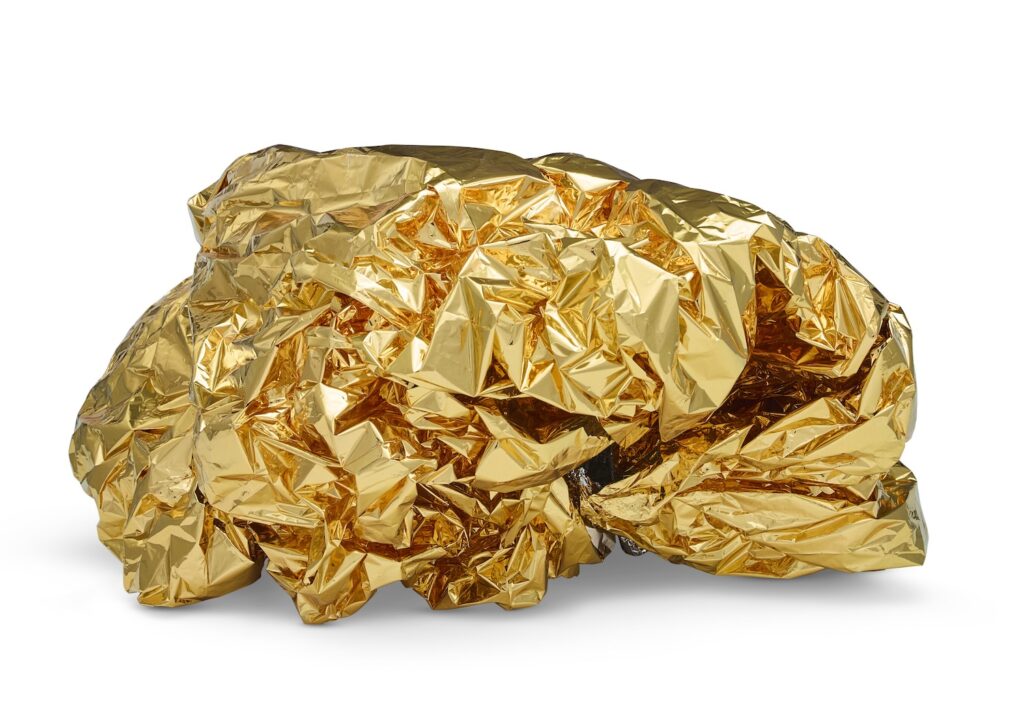 a crumpled gold tone mylar space blanket like the kind you get when you finish the new york marathon, or go camping, is formed into the rough potato shape of a boulder, but the size of a cat, and the weight of a piece of paper. somewhere inside it is a binder clip, holding it together since 2009. the rest is just care in not scrunching it. tony feher made this and his dealer brent sikkema had it, and now christie's is selling it (in feb 2025)