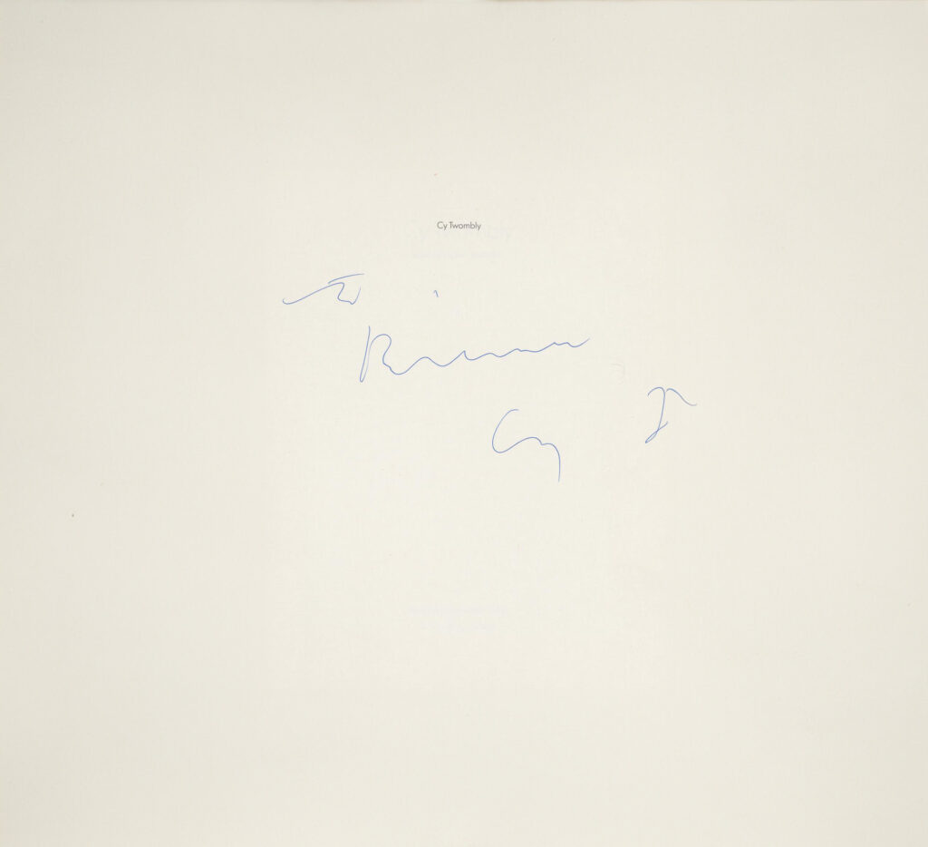 a nearly empty off white title page of an exhibition catalogue has cy twombly printed in very very small letters in the upper center, and "To Rainer, Cy T" written by hand by the artist. from the collection of rainer speck at maison d'art in los angeles in feb-may 2025