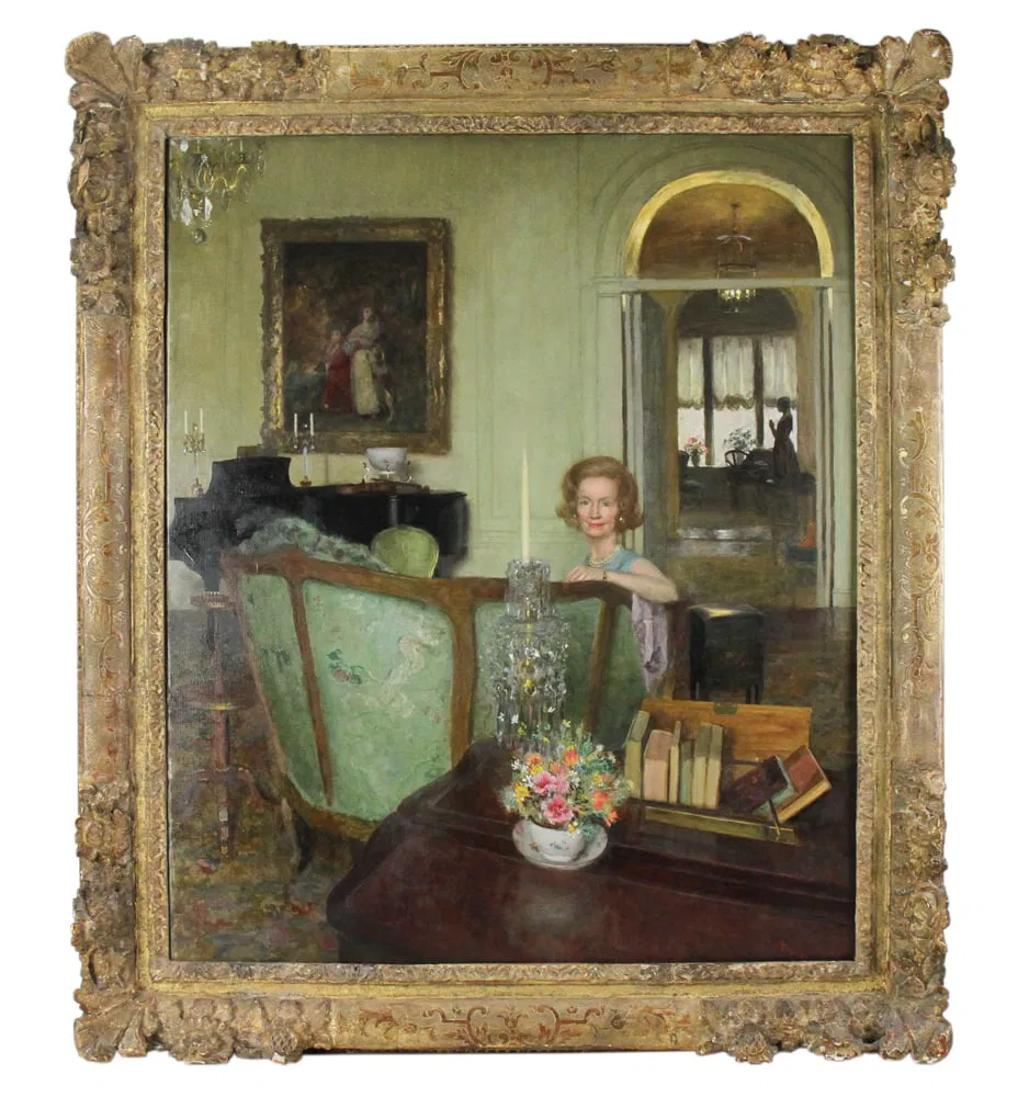 a portrait of mrs christopher devine painted in 1973 by john koch. mrs devine is seated in an elaborately decorated living room, and only her left arm, neck, and coiffed head stick above the turquoise upholstered back of the gilt canapé, an 18th century french sofa which the devines were known to collect. a mahogany card table in the foreground has a bowl of short flowers, a little rack of eight books with their spines not visible, and a crystal candlestick holder whose sole purpose is to give koch a chance to paint light reflecting off the dangly bits. a similar chandelier is barely and gratuitously poking into the upper left corner of the painting. in the background are a black grand piano with an 18th century george romney portrait of someone else's kids and ancestors hanging above it. through an overly reflective arched doorway, the background recedes to another couple of rooms, with a statue of a woman with hands in prayer, silhouetted against a white curtained window. the woodwork on the distant floor and the closeup table all glow very showily. this painting is being sold for the third time, after the first two attempts failed, and it was donated to a convent upstate.