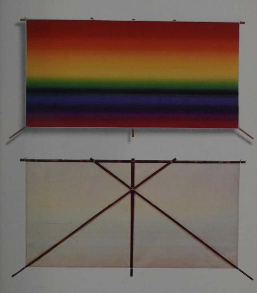 a rainbow-striped kite by ay-o is depicted from both sides, showing the 96 gradated strata of silkscreened color, and the simple, four-stick bamboo frame on the back. from the art kites project book, 1991