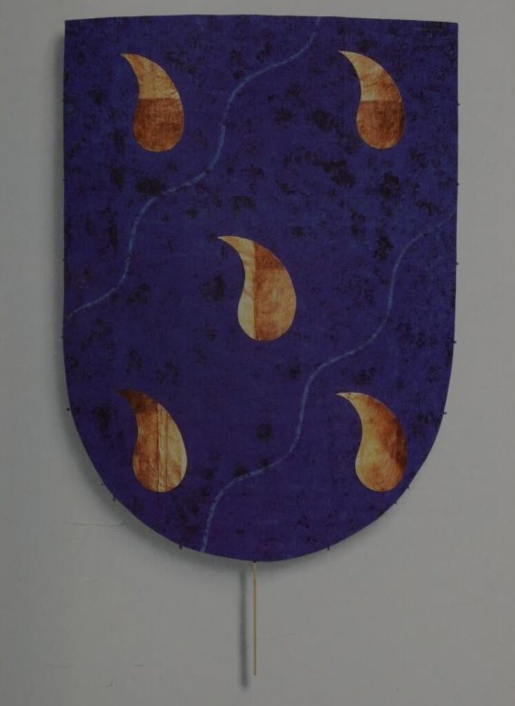 the heraldic kite by general idea is an yves klein blue shield shape with five golden or copper leaf drops on it, a symbol of piss if you ask me, but the sponsors did not ask me, so they went with golden tears.
