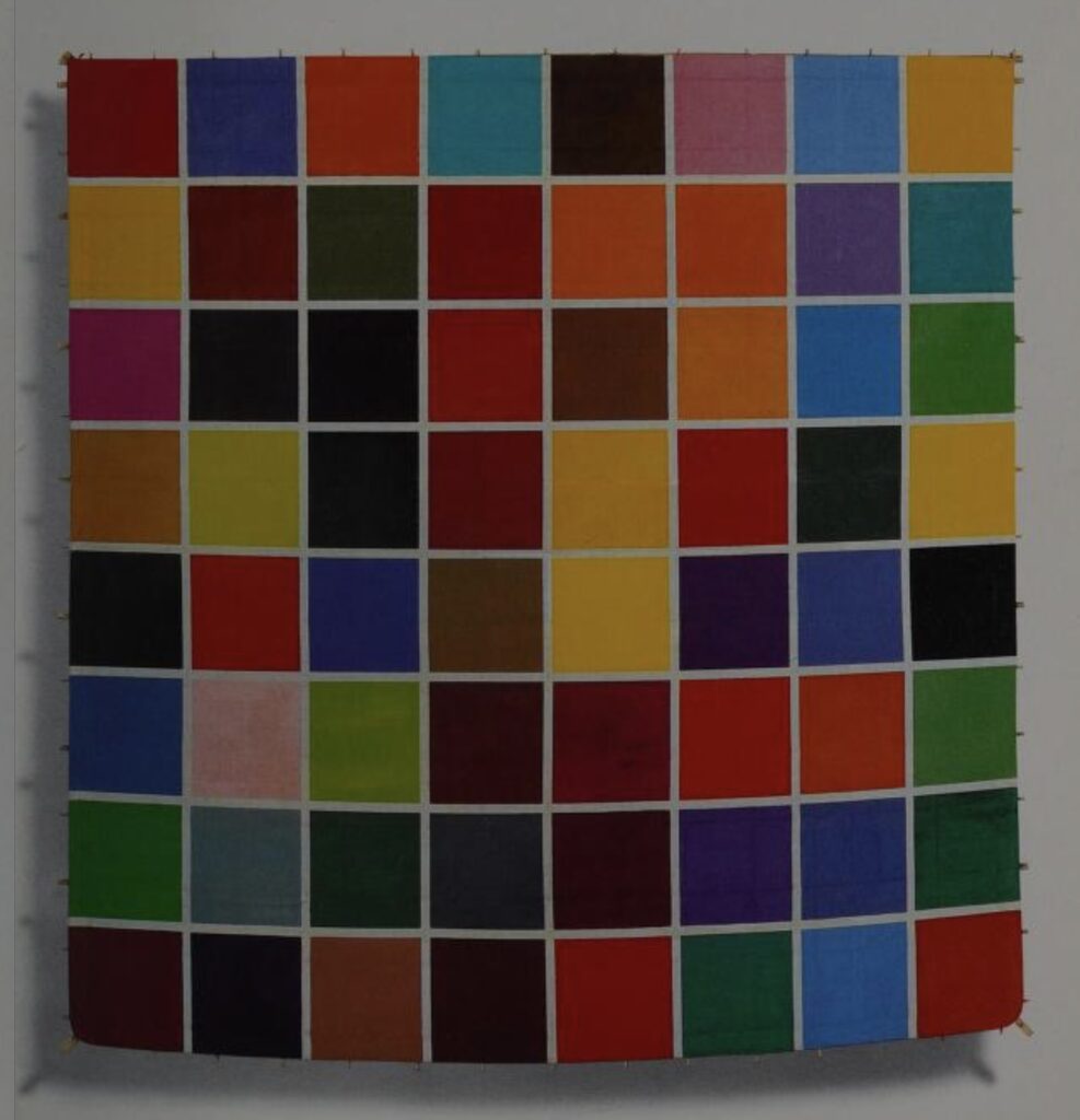 an 8x8 gerhard richter color grid painting with thin white boundaries between the 64 squares in like a dozen different colors, but it's acrylic, on japanese paper, with bamboo poles sticking out around the edges, because it is a kite. from the art kites project catalogue, 1991
