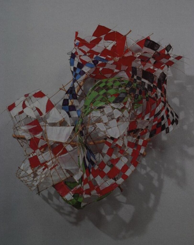 if a kite was made out of bamboo grids covered with different colors of paper like several chessboards, but it could also be crumpled into a loose blob or ball with a complicated, almost untraceable surface like aluminum foil, it would be this freeform kite by sculptor yoshio kitayama, whose medium was already bamboo and paper, so when the art kites project called, he wasn't messing around with any boring kite shape