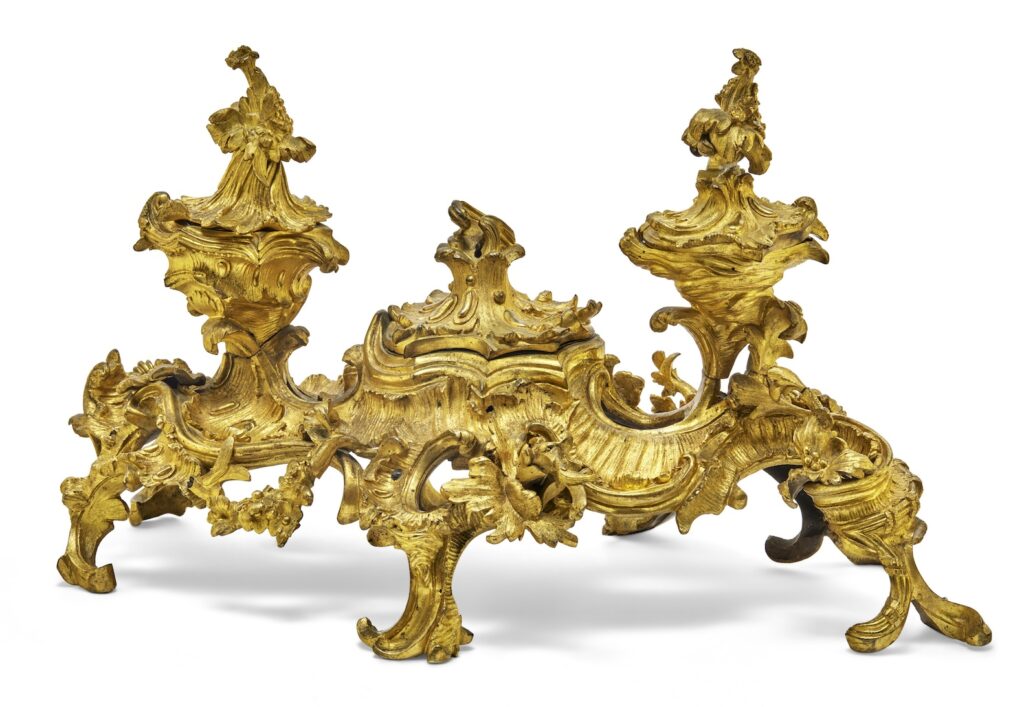 how can this be an inkwell? it is gilt bronze, with three inkpots with lids on a ring of raised legs, but the dominant aspect of it is the extremely ornate leafy asymmetrical flourishes that make it look like a spider robot or something. it is from 1740 in france, probably, though according to christie's paris, this style was also popular with aristos in germany and england at the time. this inkpot probably started the revolution, tho, as soon as some peasant saw it