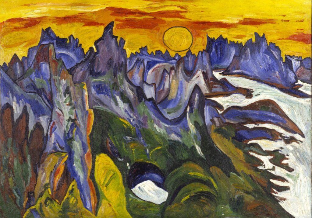 a range of spiky purple mountains poke up into a vivid yellow sky with a clearly drawn sun circle at the top center. some green in the lower valleys in the foreground and trenches of white merging into all white glaciers or snow along the left side all feel representative of lofoten norway, where william h johnson depicted the midnight sun in 1937. collection saam