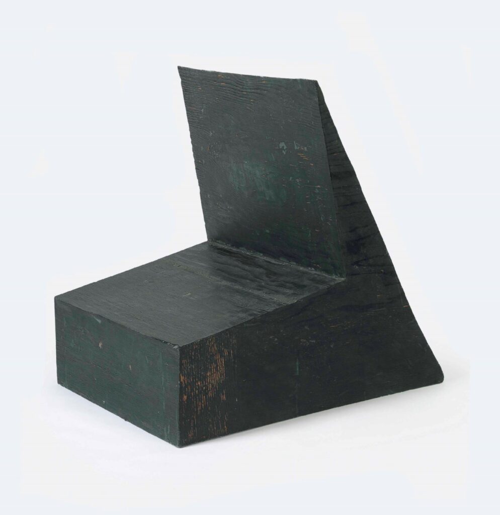 a bruce nauman sculpture in dark grey green resin and fiberglass cast from a plywood chair-shaped box with an angled seat and back, it belonged to cy twombly, then his foundation sold it off in 2014