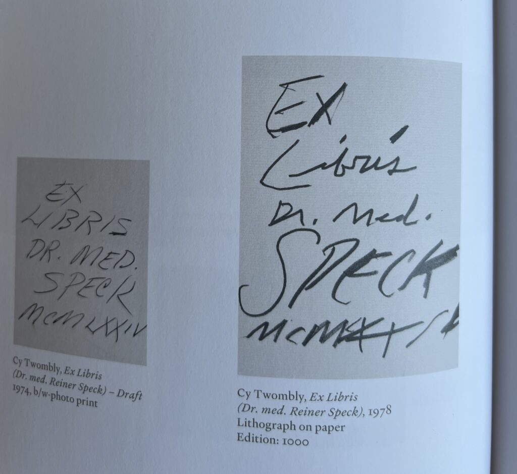 a detail of a page in the maison d'art catalogue for the 2025 show, cy twombly reiner speck: fragments of an adoration, where two versions of the bookplate twombly designed for speck are displayed side by side. a draft from 1974, and the real deal, from 1978, which, we read, was published as an edition of 1000. both bookplates say ex libris dr speck, etc., in twombly's messiest handwriting